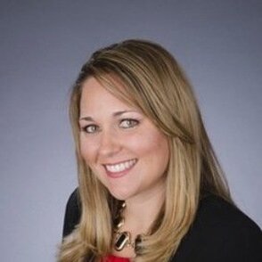 Professional headshot of Dr. Teresa Grenawalt with gray background