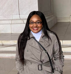 Smiling Picture of Shanice Carter Standing Outside on Campus